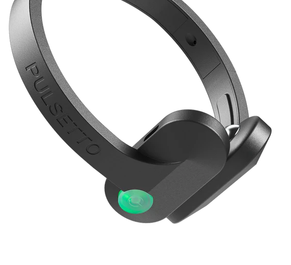 Woman wearing the Pulsetto device during a calm session at home